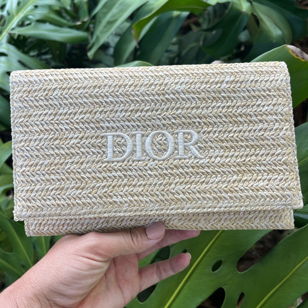 Dior zipper raffia clutch. New, protective sticker still attached to the zipper